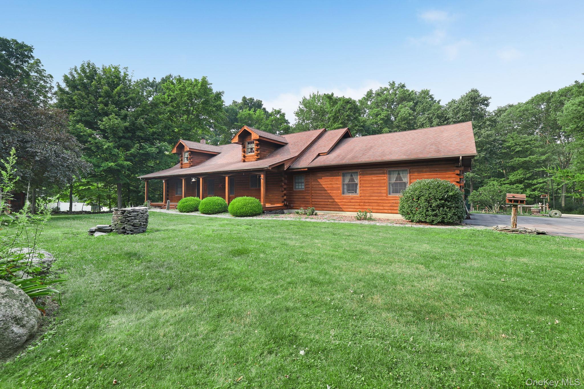 230 Post Road Slate Hill, NY 10973 - Photo 24 of 26 There's an attached two car garage for your vehicles and a paved driveway.
