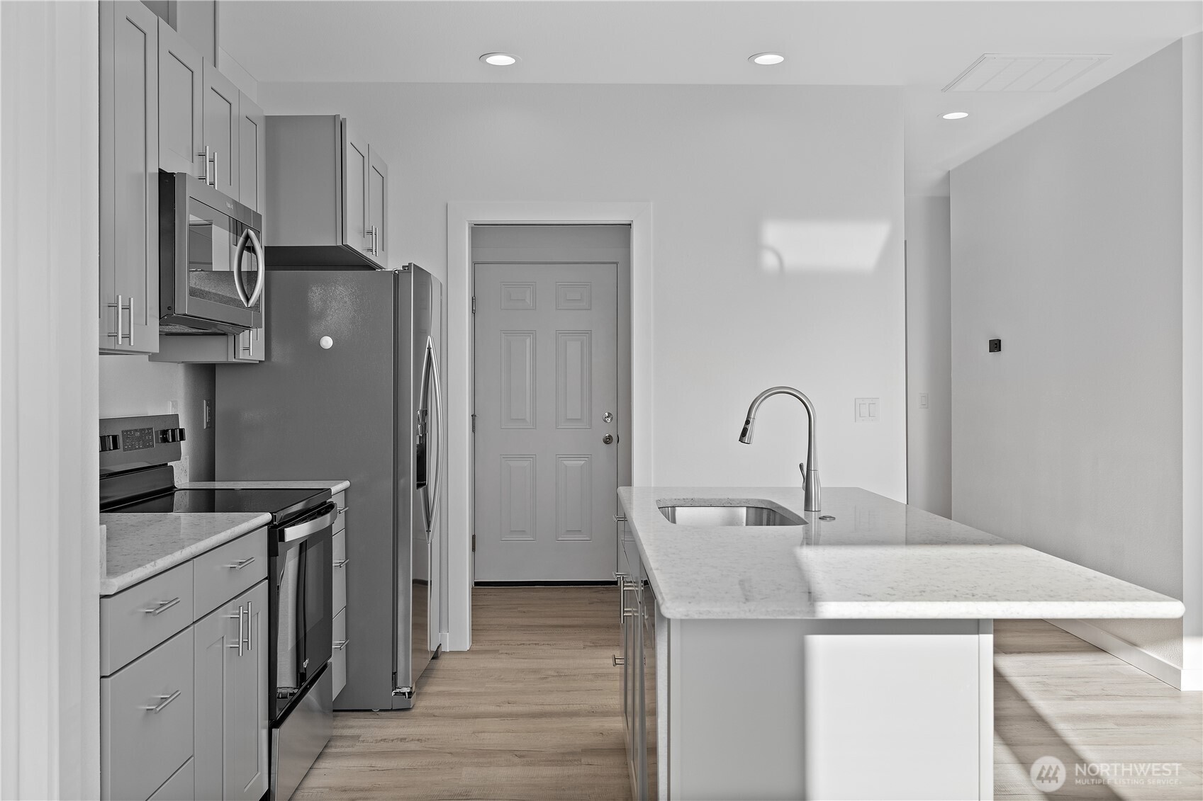 608 4th Street Mattawa, WA 99349 - Photo 11 of 40 a kitchen with stainless steel appliances a sink stove and refrigerator