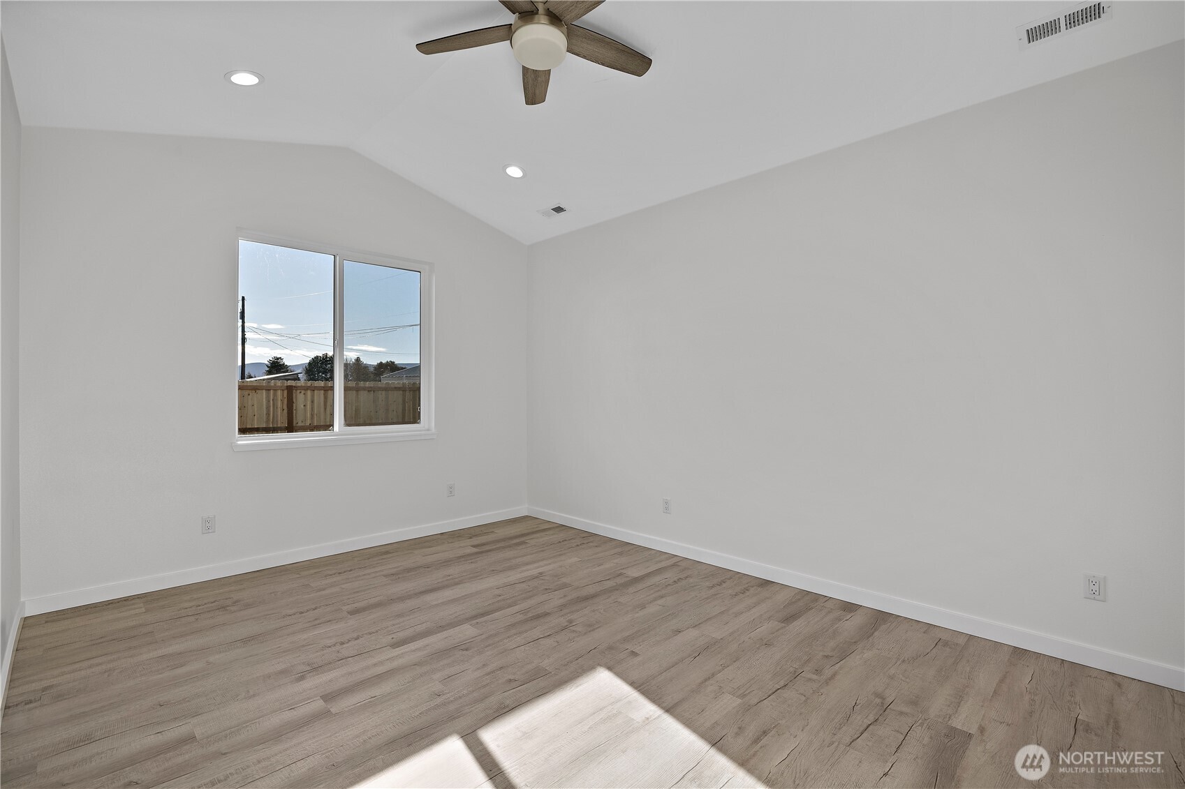 608 4th Street Mattawa, WA 99349 - Photo 12 of 40 an empty room with a window and a ceiling fan