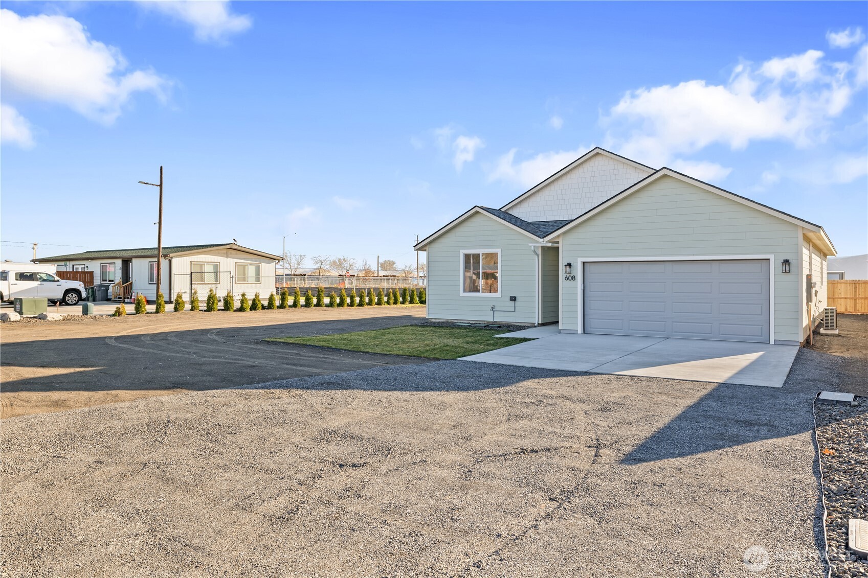 608 4th Street Mattawa, WA 99349 - Photo 32 of 40 a house with a bench in front of it