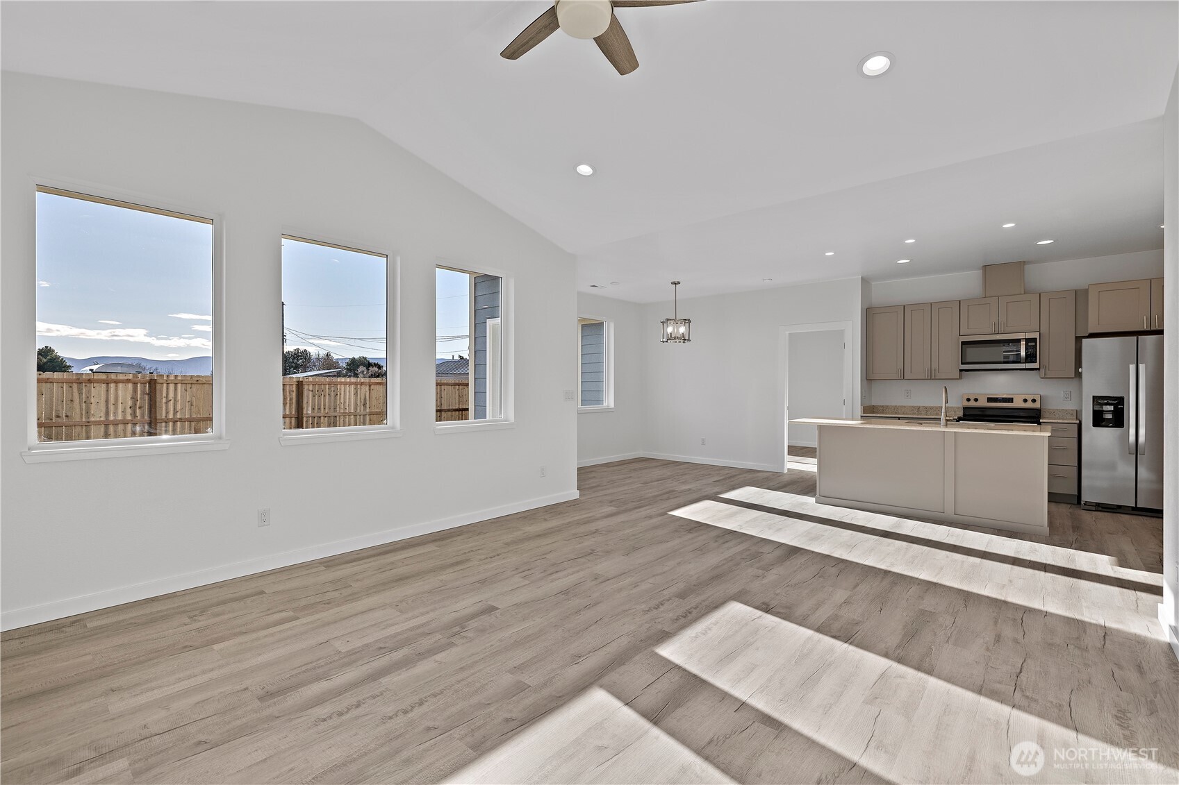 608 4th Street Mattawa, WA 99349 - Photo 6 of 40 a view of kitchen with stainless steel appliances refrigerator stove microwave and cabinets