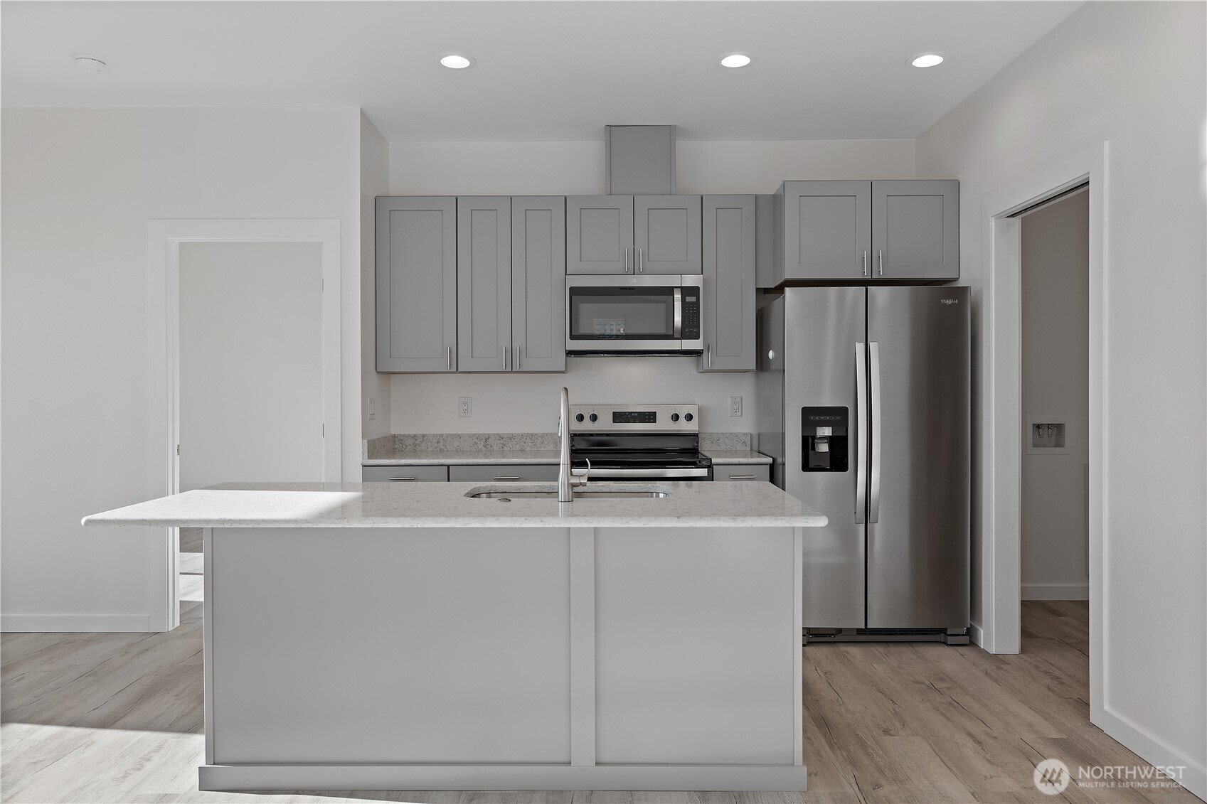 608 4th Street Mattawa, WA 99349 - Photo 10 of 40 a kitchen with cabinets and stainless steel appliances
