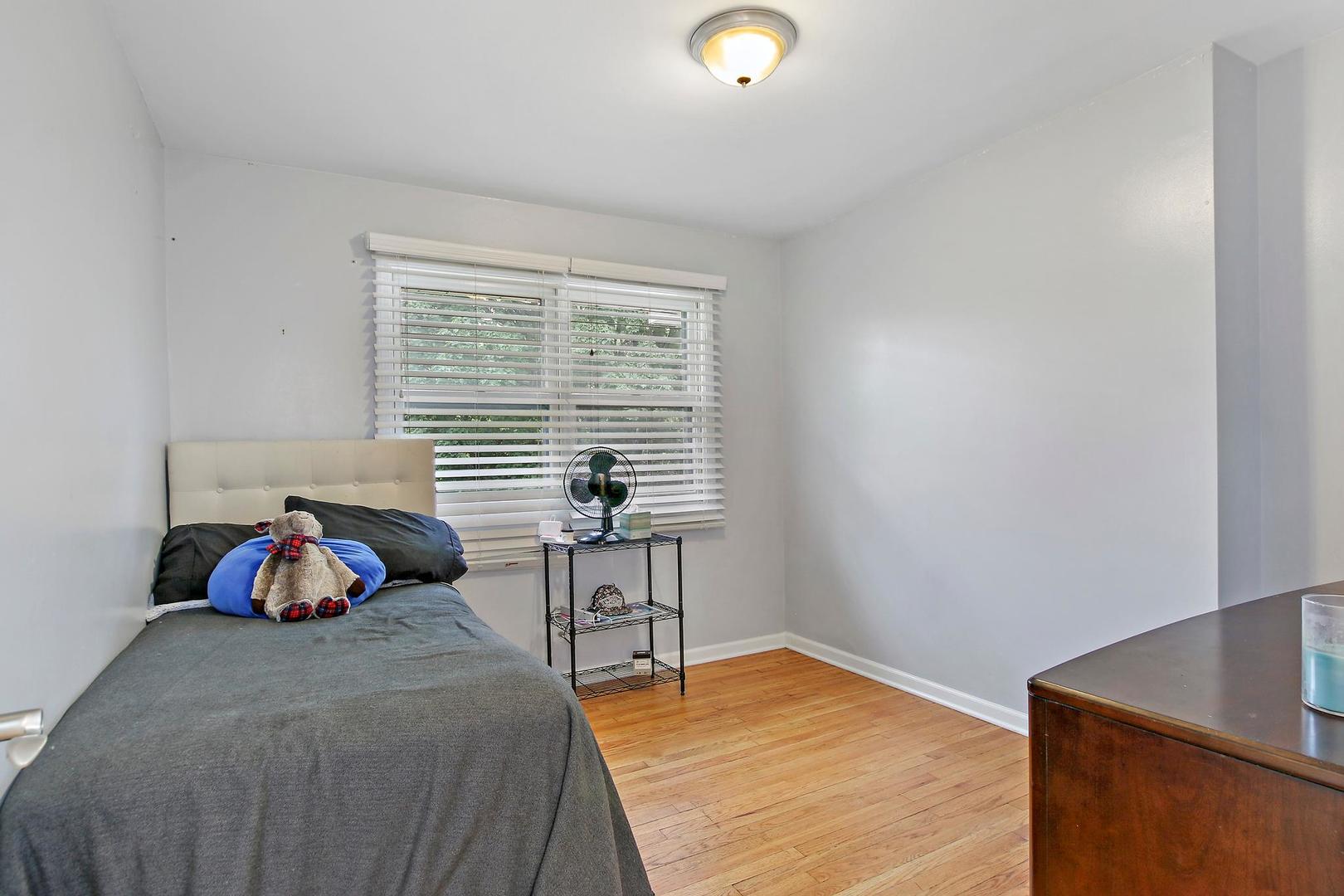 703 Crestview Drive Ingleside, IL 60041 - Photo 13 of 28 a bedroom with a bed and a window