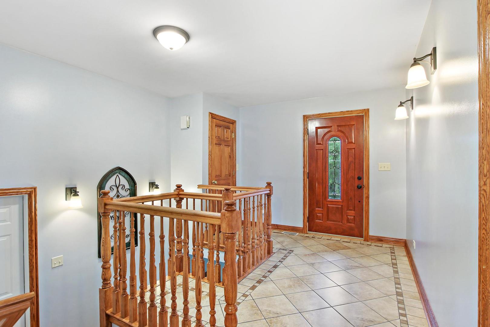 703 Crestview Drive Ingleside, IL 60041 - Photo 3 of 28 a view of front door with entryway