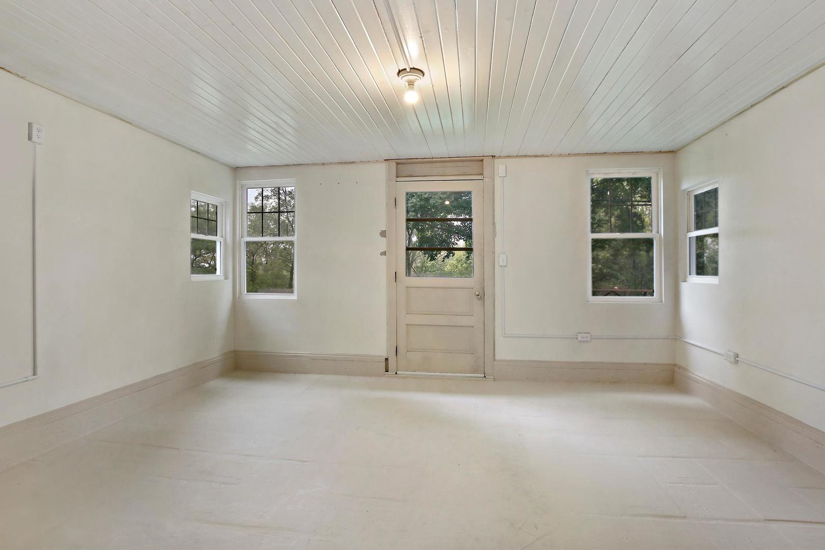 703 Crestview Drive Ingleside, IL 60041 - Photo 21 of 28 an empty room with windows