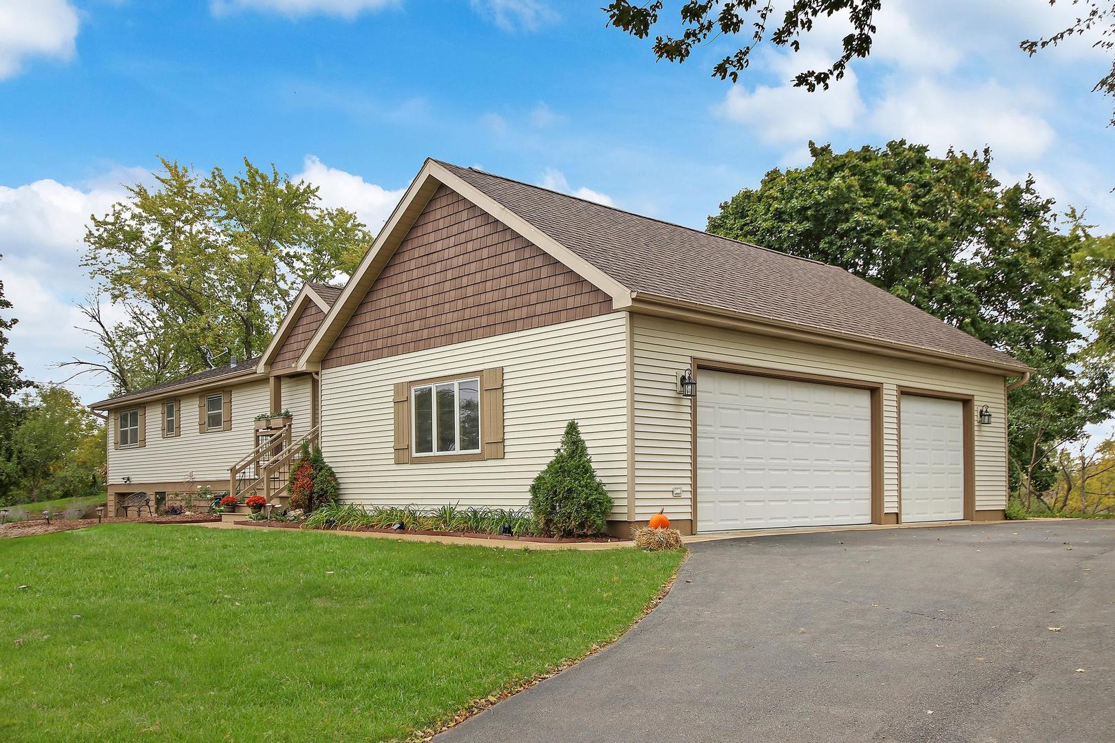 703 Crestview Drive Ingleside, IL 60041 - Photo 28 of 28 a view of a house with a yard and garden
