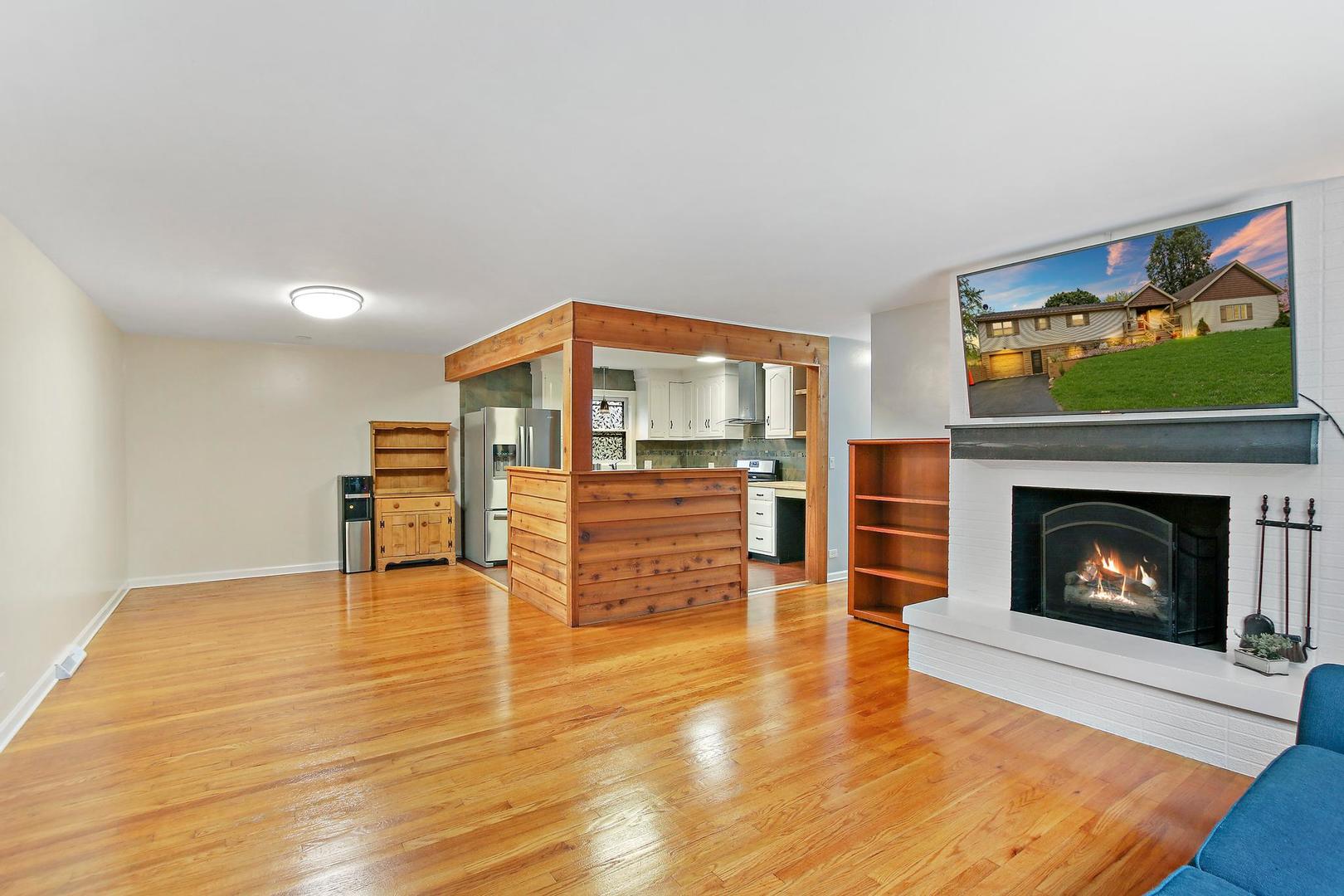 703 Crestview Drive Ingleside, IL 60041 - Photo 8 of 28 a living room with furniture and a fireplace