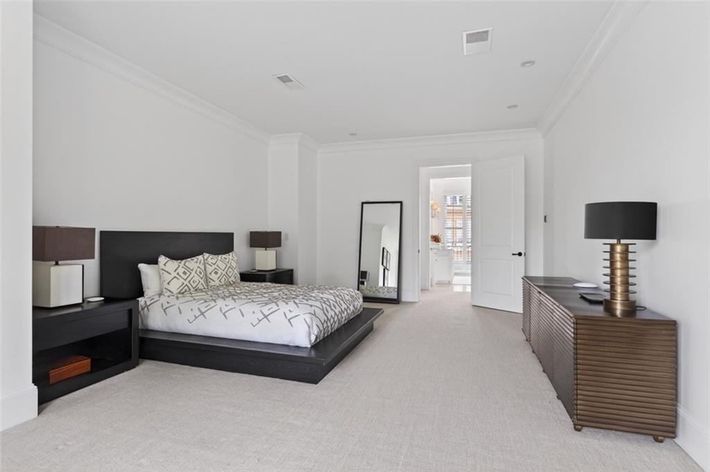 2288 Peachtree Road Northwest, Unit 4 Atlanta, GA 30309 - Photo 19 of 50 a bedroom with a bed and a lamp