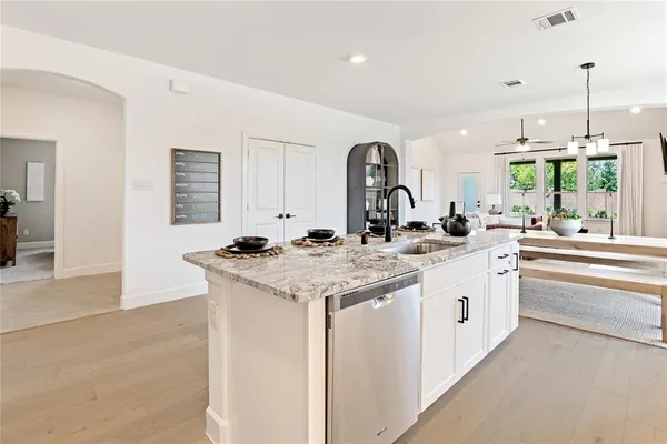 a spacious bathroom with a double vanity sink mirror and double