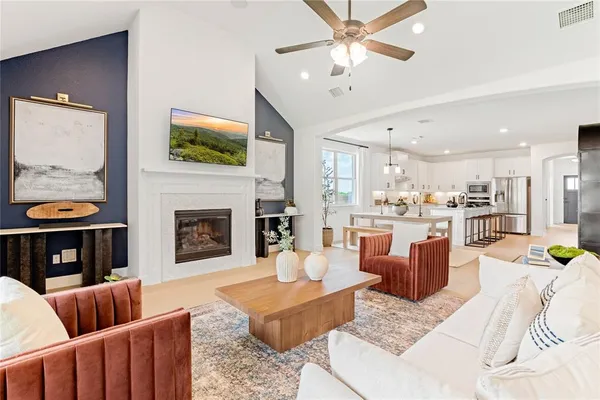 a bathroom with double vanity sinks a mirror and a shower