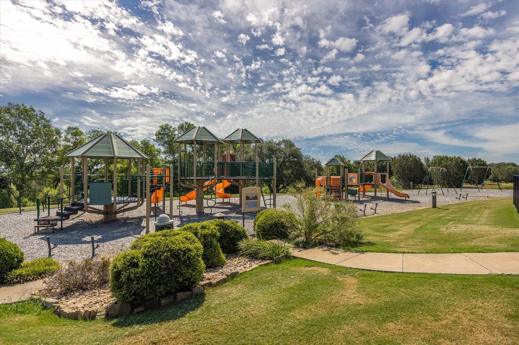 7308 Castle Royle Court Cleburne, TX 76033 - Photo 12 of 35 View of playground featuring a yard