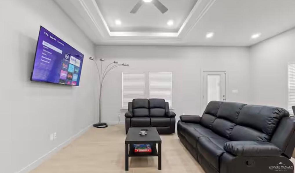 2310 Treasure Cove Harlingen, TX 78550 - Photo 20 of 23 a living room with furniture a couch and a flat screen tv