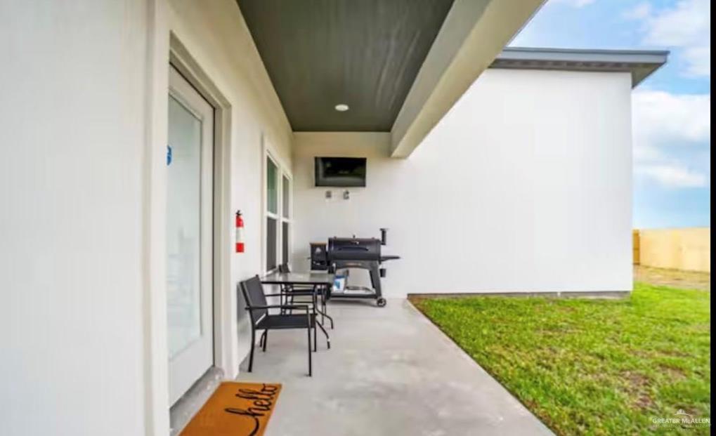 2310 Treasure Cove Harlingen, TX 78550 - Photo 23 of 23 a living room with furniture and a flat screen tv