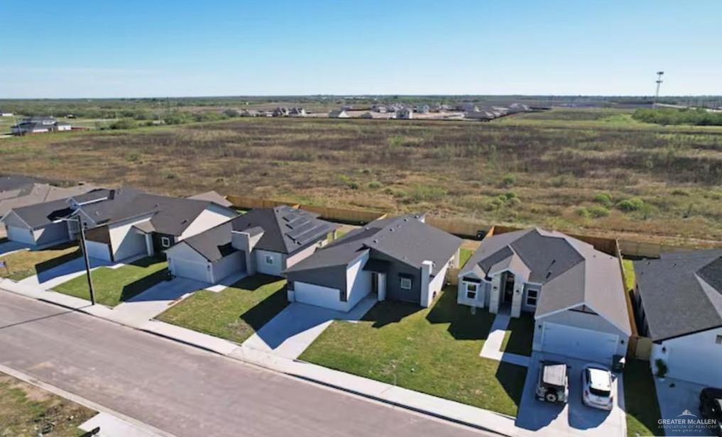 2310 Treasure Cove Harlingen, TX 78550 - Photo 6 of 23 a view of a lake with couches and city view