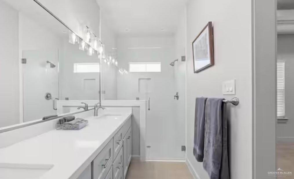 2310 Treasure Cove Harlingen, TX 78550 - Photo 9 of 23 a bathroom with double vanity sink and a mirror