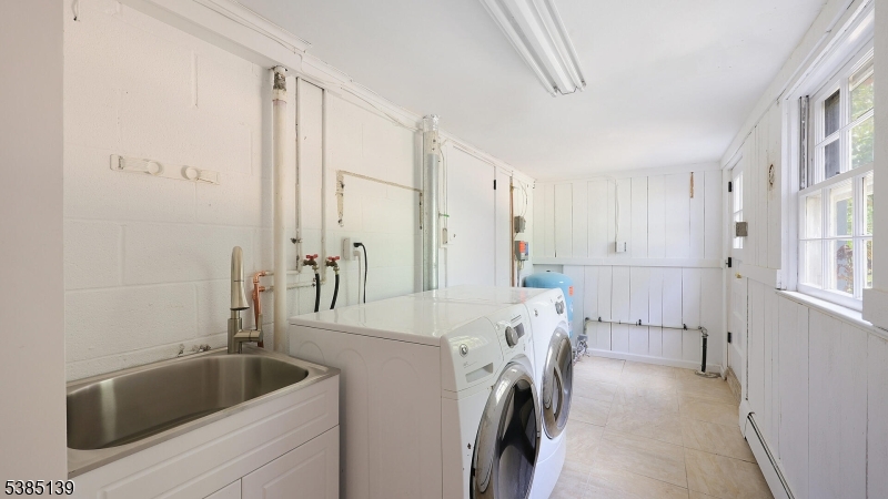 59 Ferguson Road Warren, NJ 07059 - Photo 18 of 26 a bathroom with a tub sink and toilet