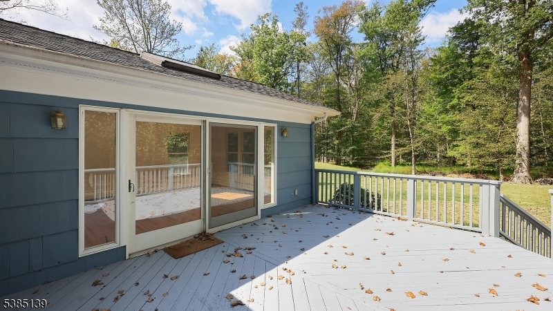 59 Ferguson Road Warren, NJ 07059 - Photo 21 of 26 a view of a deck with a large window and wooden fence