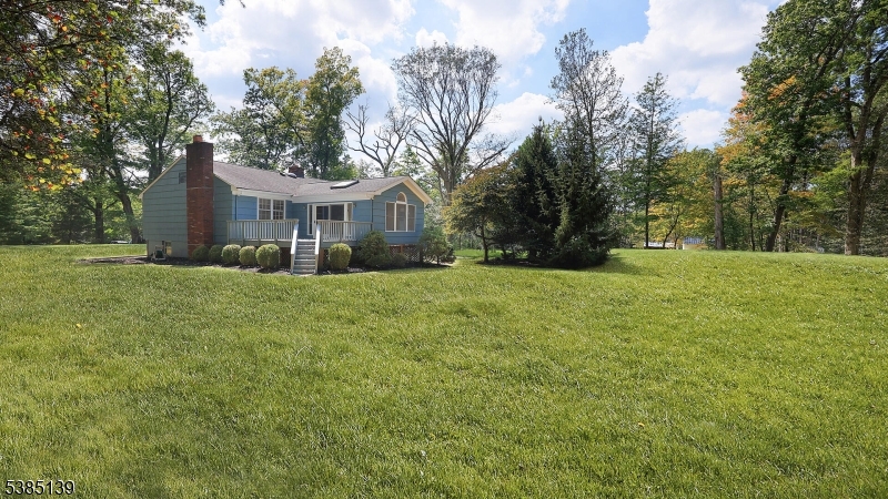 59 Ferguson Road Warren, NJ 07059 - Photo 24 of 26 a front view of house with yard and trees