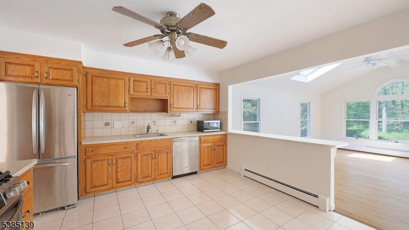 59 Ferguson Road Warren, NJ 07059 - Photo 6 of 26 a kitchen with cabinets stainless steel appliances and a window