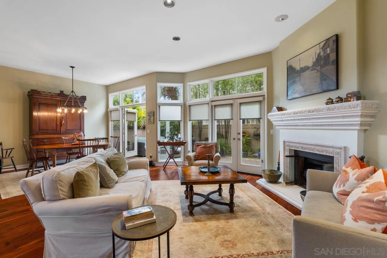 3128 Almahurst Row La Jolla, CA 92037 - Photo 5 of 21 a living room with furniture a flat screen tv and a fireplace