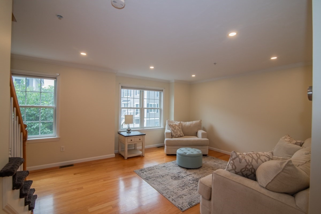 1975 Middlesex Street, Unit 51 Lowell, MA 01851 - Photo 13 of 34 a living room with furniture and a window