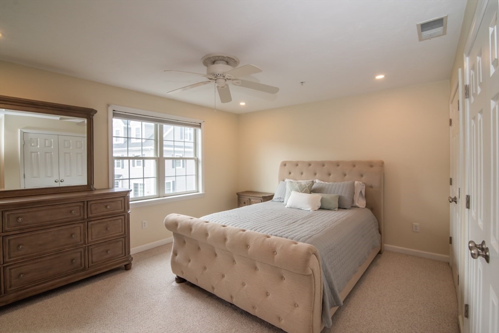 1975 Middlesex Street, Unit 51 Lowell, MA 01851 - Photo 19 of 34 a bedroom with a bed and window