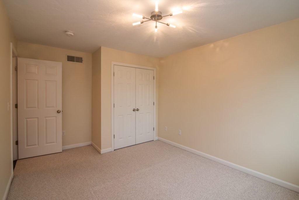 1975 Middlesex Street, Unit 51 Lowell, MA 01851 - Photo 22 of 34 wooden floor in an empty room