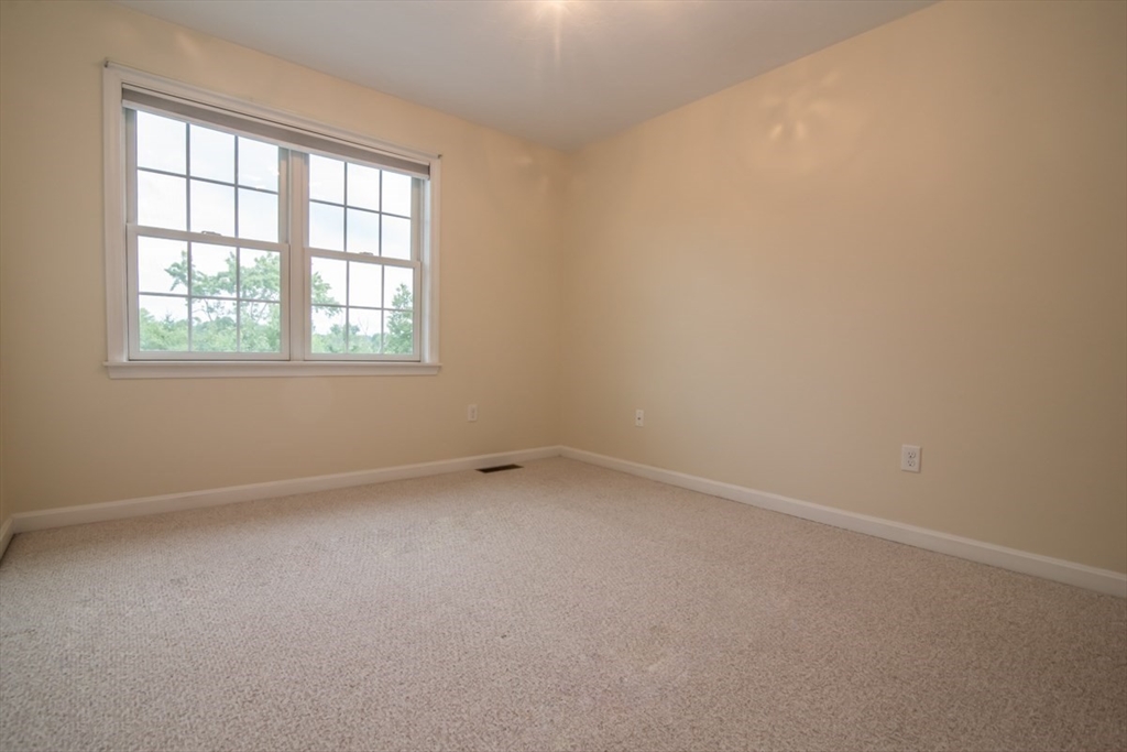 1975 Middlesex Street, Unit 51 Lowell, MA 01851 - Photo 24 of 34 an empty room with a window