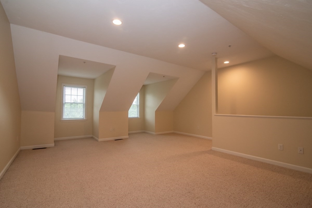 1975 Middlesex Street, Unit 51 Lowell, MA 01851 - Photo 26 of 34 an empty room with a empty space and windows