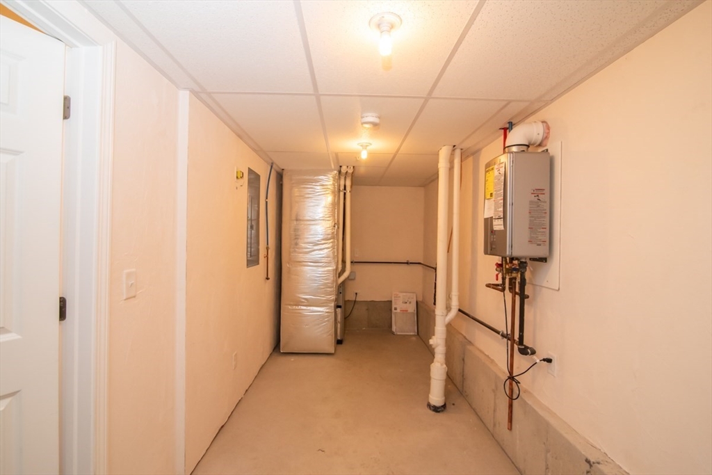 1975 Middlesex Street, Unit 51 Lowell, MA 01851 - Photo 29 of 34 a bathroom with a shower and a toilet