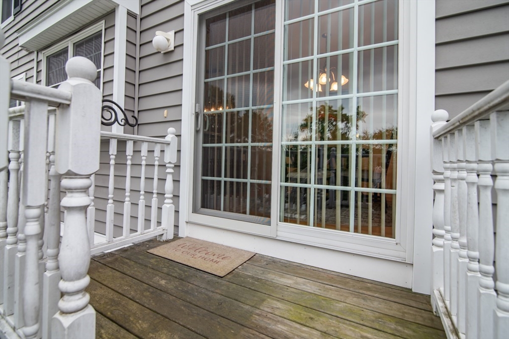 1975 Middlesex Street, Unit 51 Lowell, MA 01851 - Photo 33 of 34 a view of a balcony with wooden floor