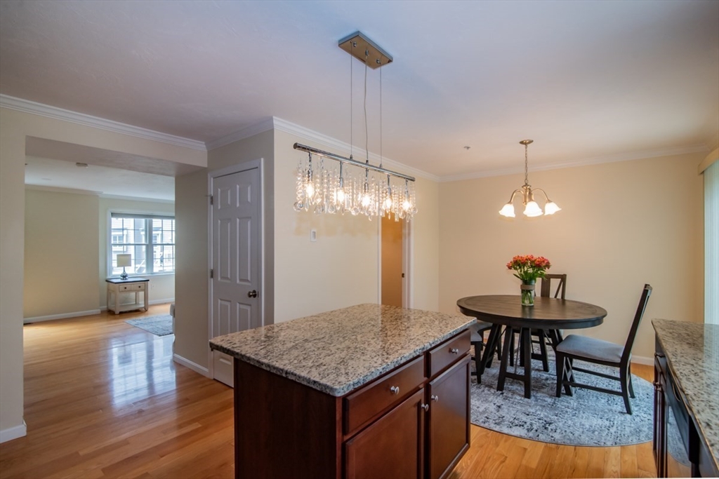 1975 Middlesex Street, Unit 51 Lowell, MA 01851 - Photo 6 of 34 a view of a kitchen tables and dining table chairs