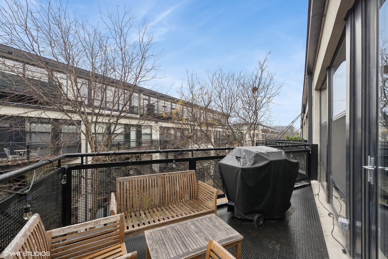 1069 West 14th Place, Unit 305 Chicago, IL 60608 - Photo 12 of 15 a terrace of a house with outdoor seating