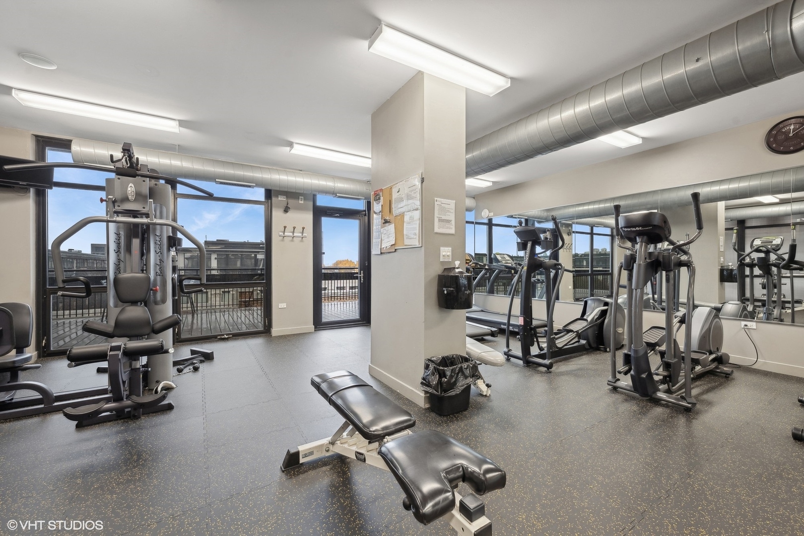 1069 West 14th Place, Unit 305 Chicago, IL 60608 - Photo 13 of 15 a view of a room with gym equipment
