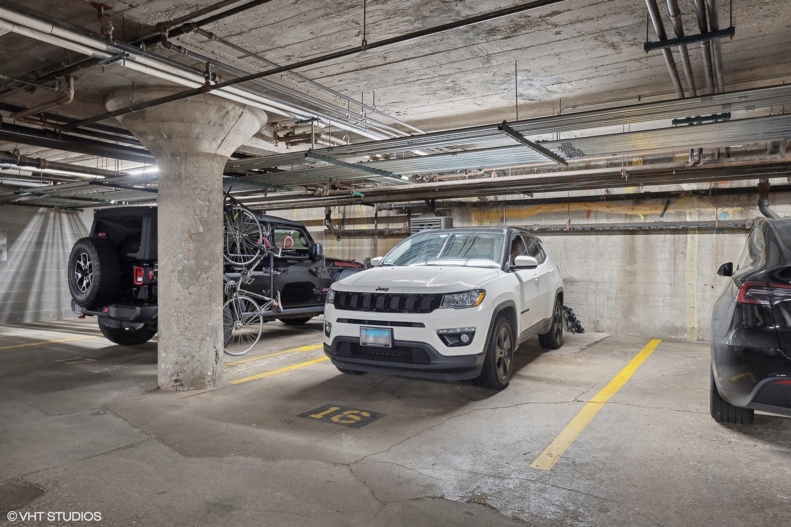 1069 West 14th Place, Unit 305 Chicago, IL 60608 - Photo 15 of 15 a car parked in a garage