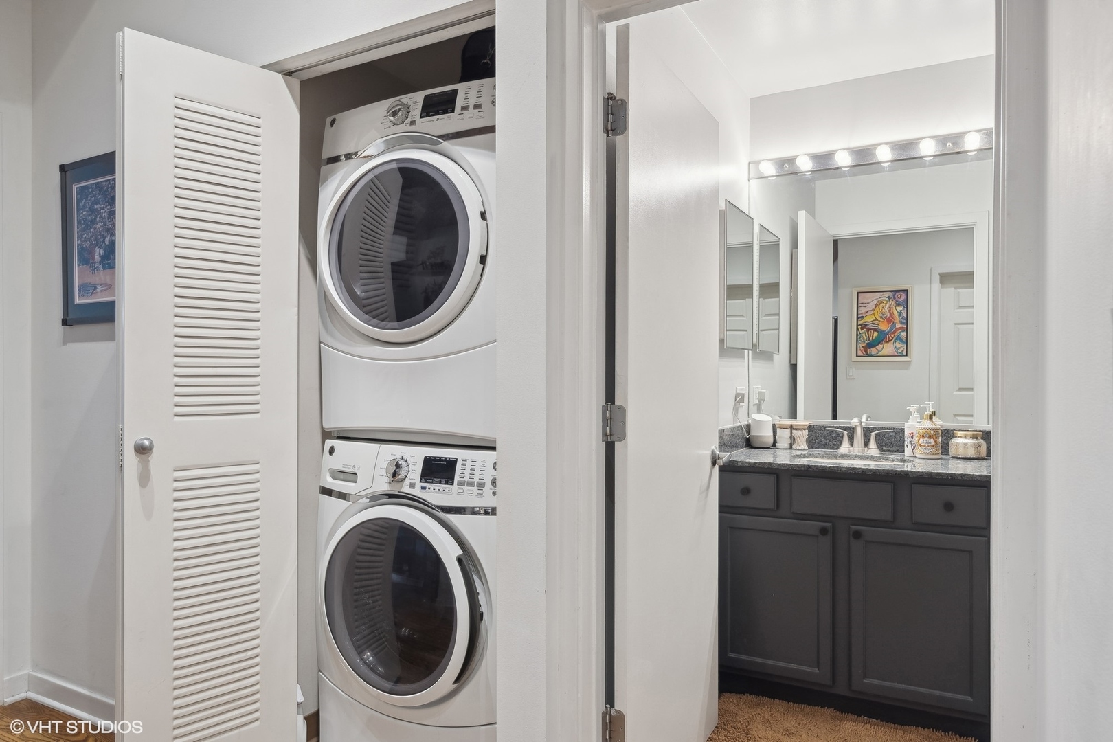 1069 West 14th Place, Unit 305 Chicago, IL 60608 - Photo 8 of 15 a view of a hallway with washer and dryer