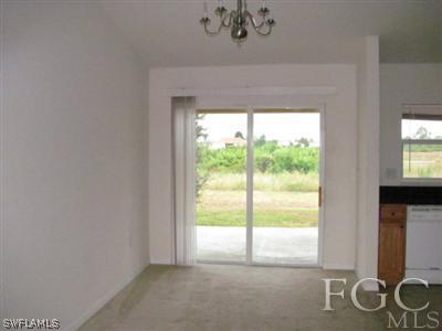 2805 23rd Street Southwest Lehigh Acres, FL 33976 - Photo 3 of 10 a view of an empty room with a window