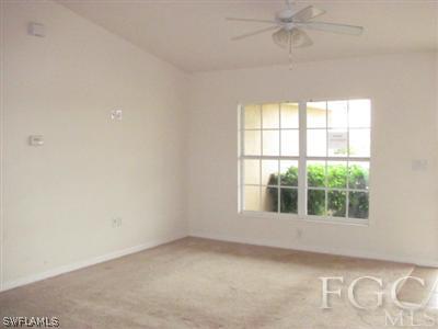 2805 23rd Street Southwest Lehigh Acres, FL 33976 - Photo 5 of 10 an empty room with a window