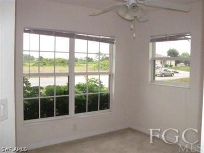 2805 23rd Street Southwest Lehigh Acres, FL 33976 - Photo 6 of 10 a view of an empty room with a window