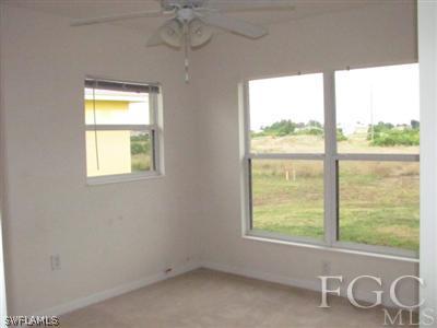 2805 23rd Street Southwest Lehigh Acres, FL 33976 - Photo 8 of 10 a view of an empty room with a window