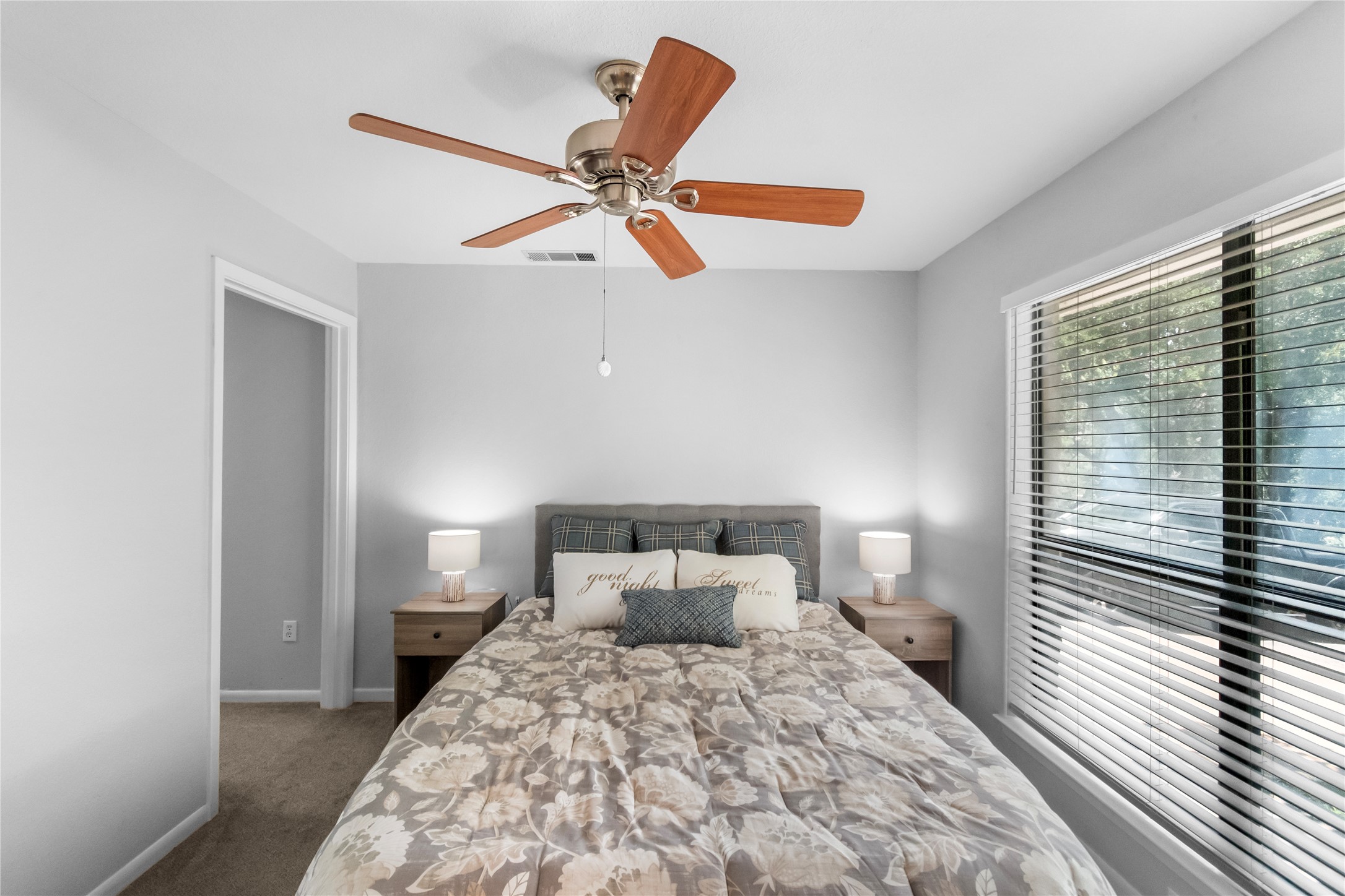 210 Teeoff, Unit B Horseshoe Bay, TX 78657 - Photo 22 of 38 A comforting bedroom features plush carpet and an overhead fan for ultimate relaxation.