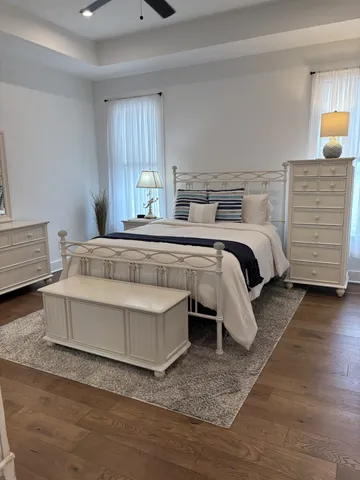 a living room with a couch and dresser