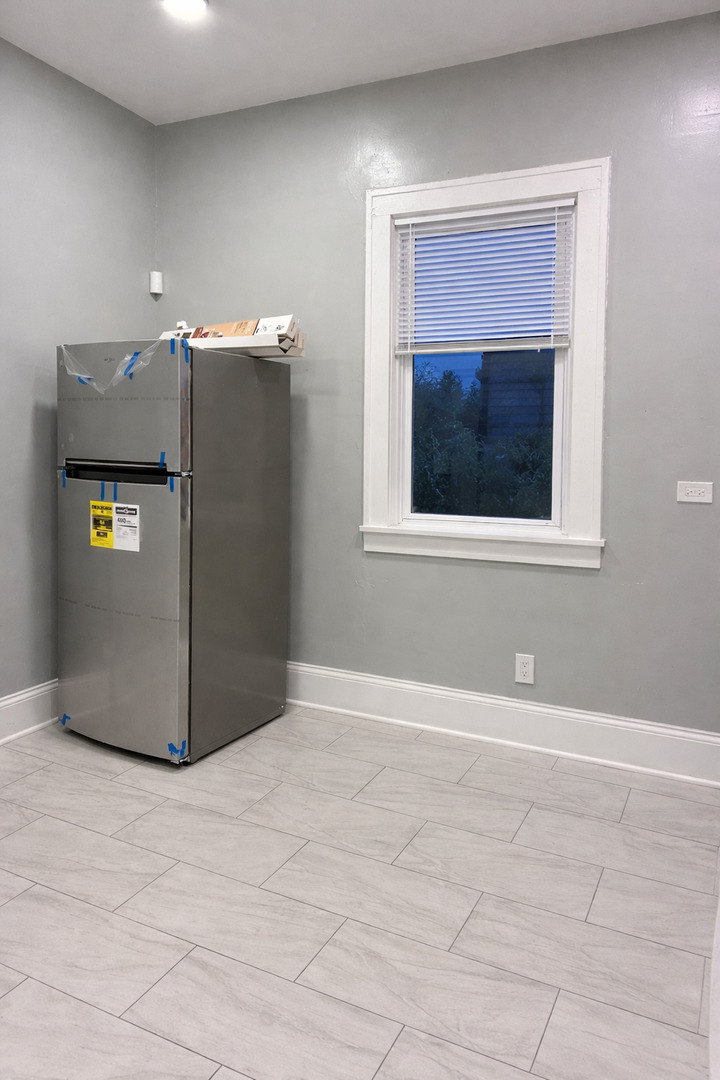 5543 South Shields Avenue Chicago, IL 60621 - Photo 9 of 12 a view of a livingroom with a staircase