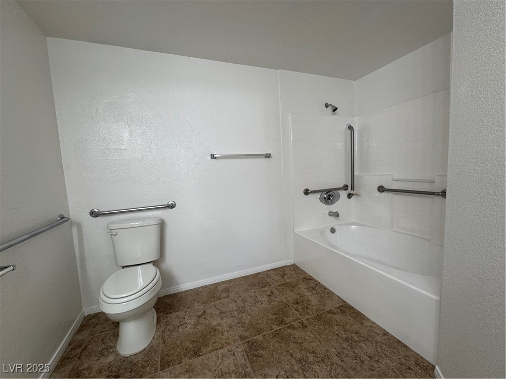 9975 Peace Way, Unit 1140 Las Vegas, NV 89147 - Photo 12 of 23 Full bath featuring toilet, tile patterned flooring, bathtub / shower combination, and baseboards