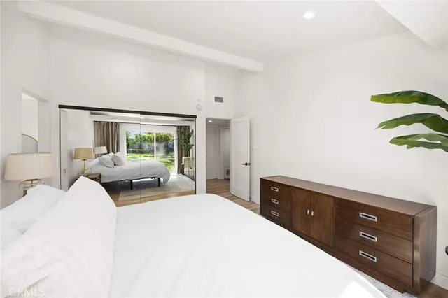 a bathroom with a shower sink and mirror