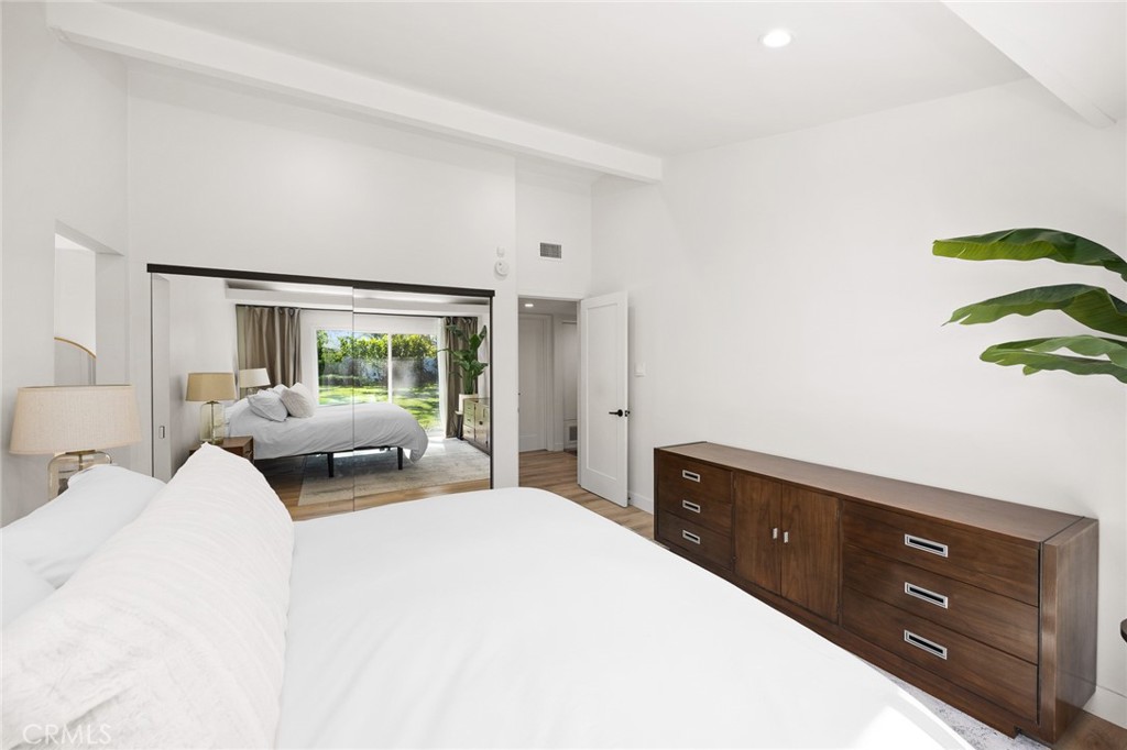 18234 Tribune Street Porter Ranch, CA 91326 - Photo 18 of 26 a bedroom with a bed and large window