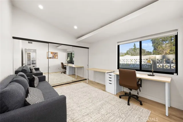 a view of a house with backyard sitting area and garden