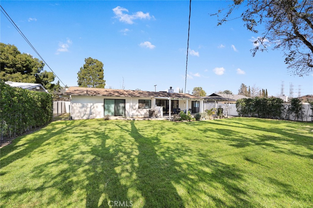 18234 Tribune Street Porter Ranch, CA 91326 - Photo 23 of 26 a front view of a house with a garden