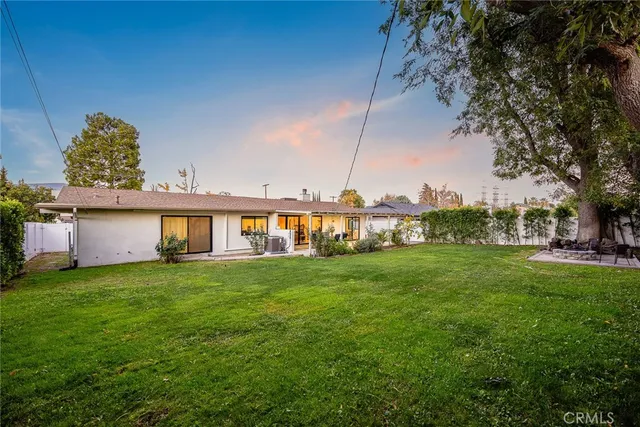 a view of a park with large trees
