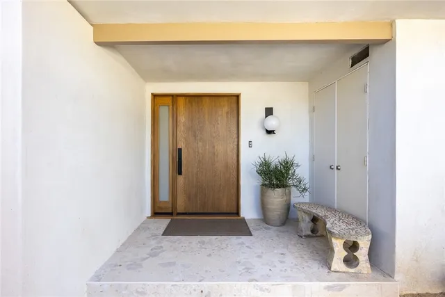 a view of a door and a window